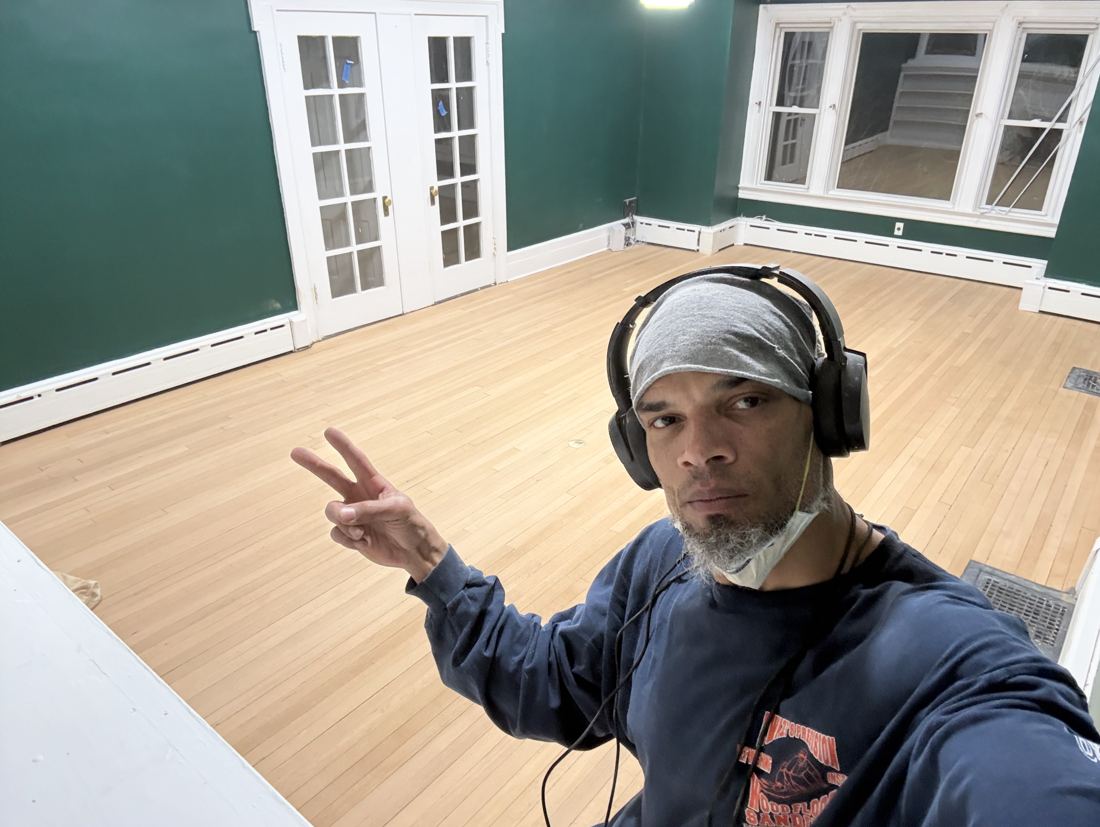 Same room after sanding, with smooth light hardwood floor