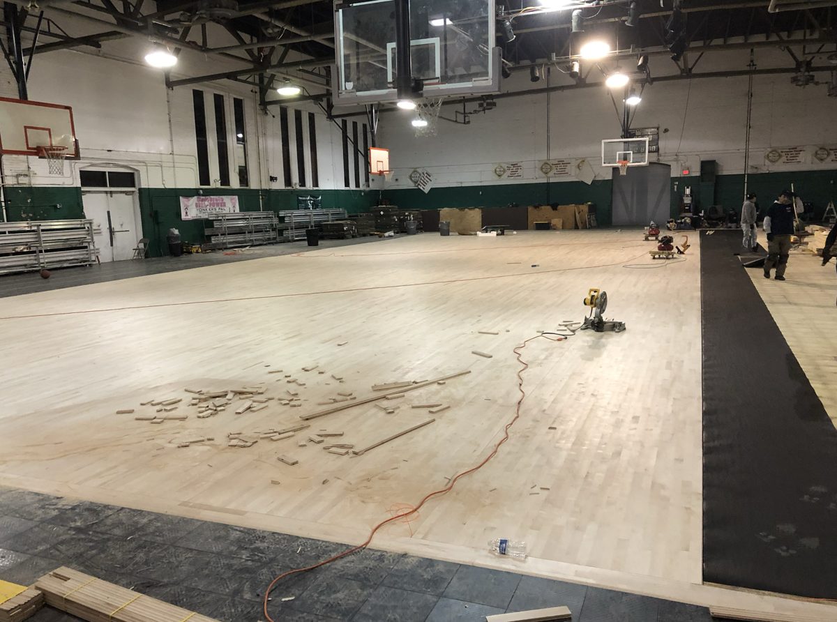 Large area of freshly installed bare hardwood with a miter saw